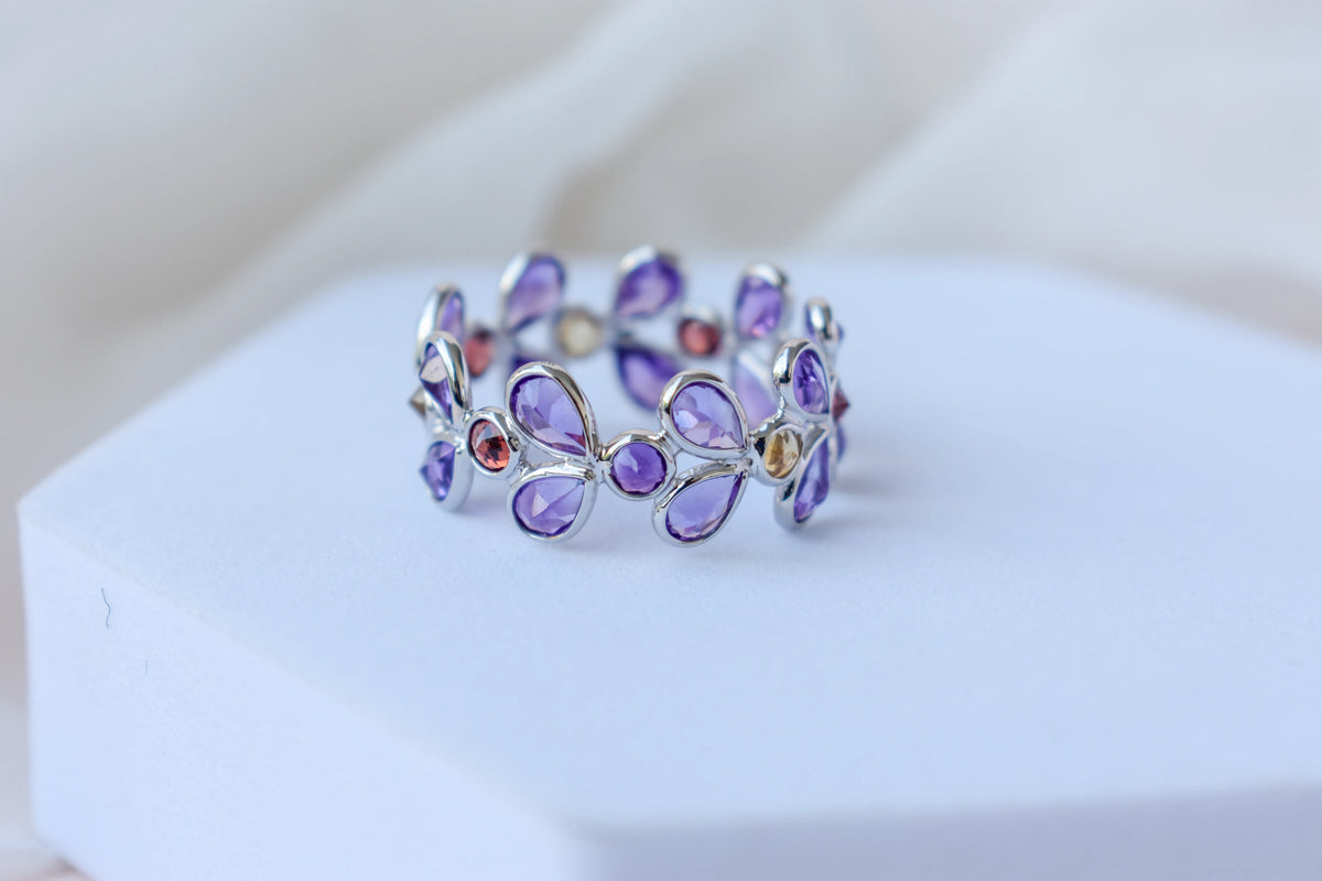 Multi gemstone marquise eternity ring in 925 silver with amethyst, garnet, and citrine-toned stones