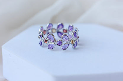 Multi gemstone marquise eternity ring in 925 silver with amethyst, garnet, and citrine-toned stones