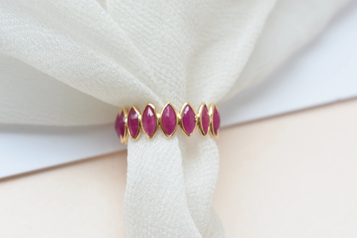 Marquise-cut ruby zigzag double-row eternity ring in 18K gold