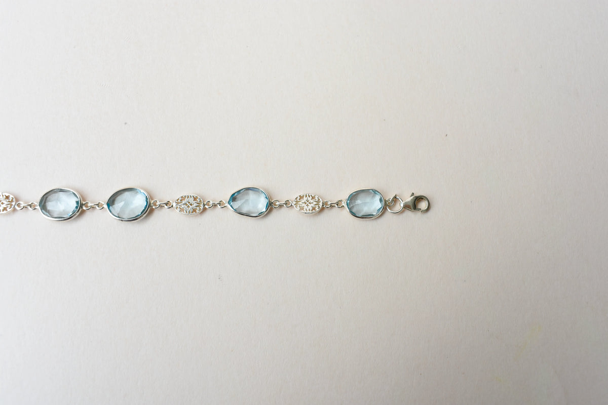 Blue gemstone bezel bracelet in silver with lobster clasp