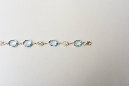 Blue gemstone bezel bracelet in silver with lobster clasp