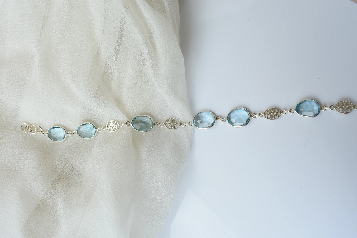 Blue gemstone bezel bracelet in silver with lobster clasp