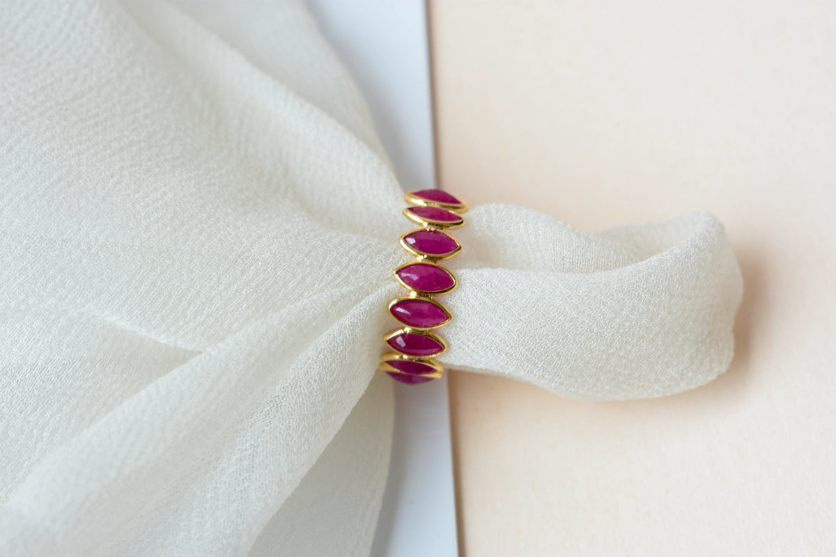 Marquise-cut ruby zigzag double-row eternity ring in 18K gold