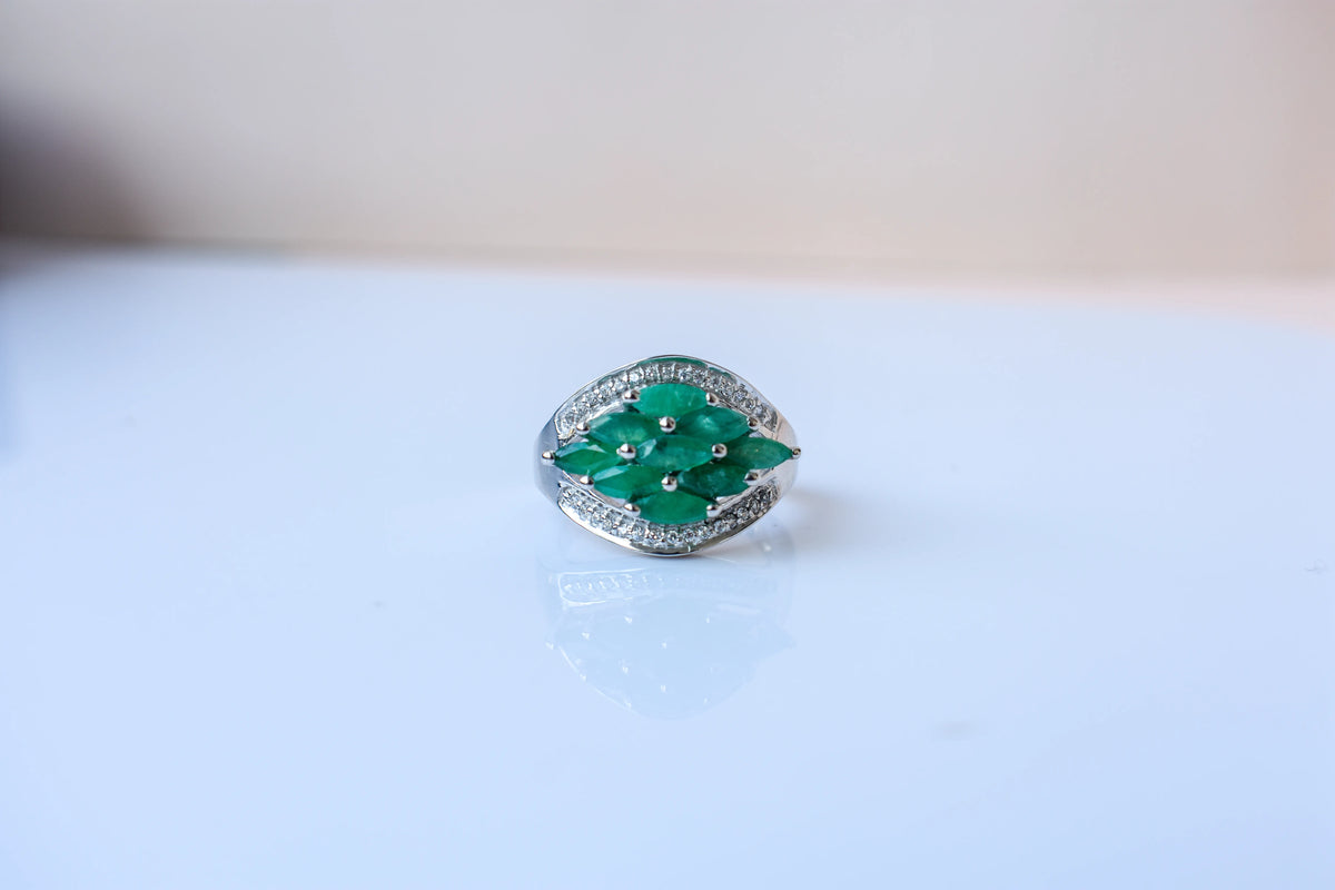 Emerald cluster ring in 925 silver with marquise-cut emeralds and cubic zirconia band