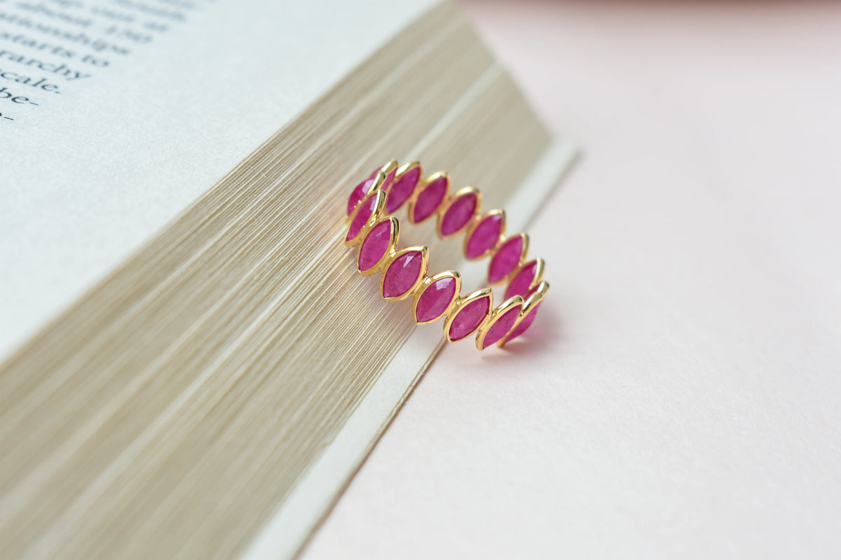 Marquise-cut ruby zigzag double-row eternity ring in 18K gold