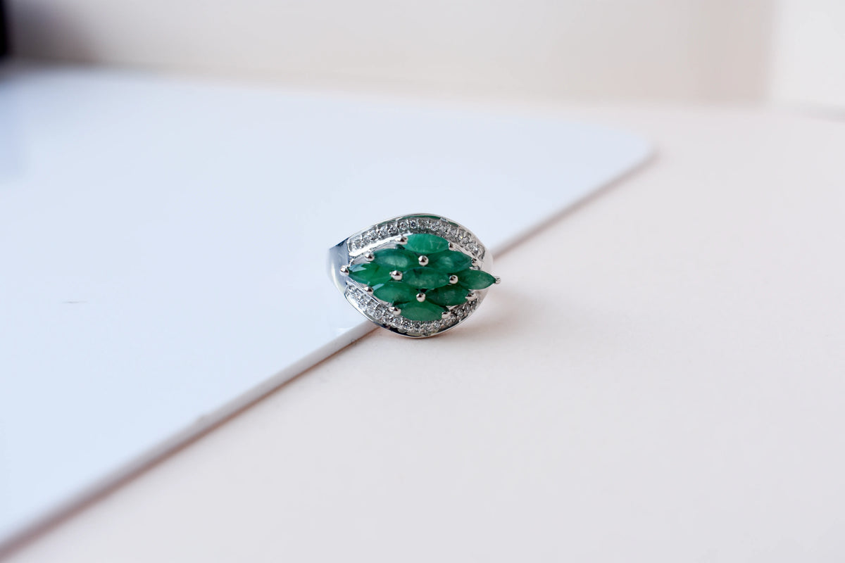 Emerald cluster ring in 925 silver with marquise-cut emeralds and cubic zirconia band