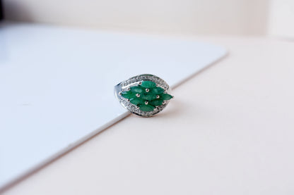 Emerald cluster ring in 925 silver with marquise-cut emeralds and cubic zirconia band