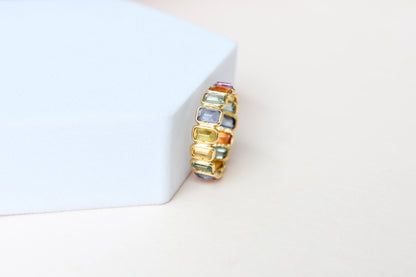Emerald-cut multicolor sapphire eternity ring in 18K gold