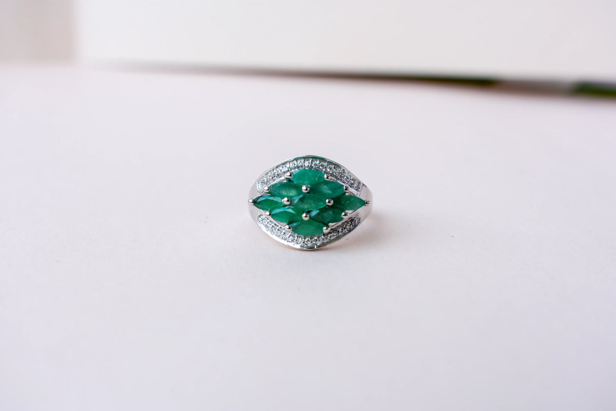 Emerald cluster ring in 925 silver with marquise-cut emeralds and cubic zirconia band