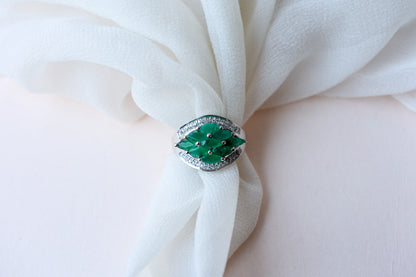 Emerald cluster ring in 925 silver with marquise-cut emeralds and cubic zirconia band