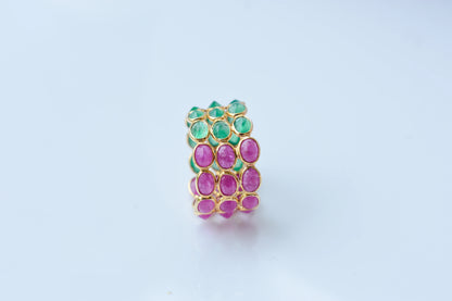 Two-tone emerald and ruby eternity ring in 18K gold