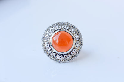 Orange cabochon gemstone ring in 925 silver with ornate scrollwork setting