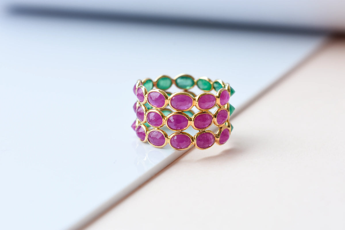 Two-tone emerald and ruby eternity ring in 18K gold