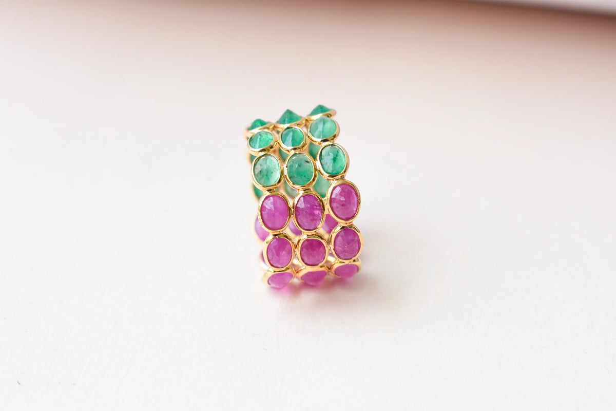 Two-tone emerald and ruby eternity ring in 18K gold