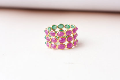 Two-tone emerald and ruby eternity ring in 18K gold