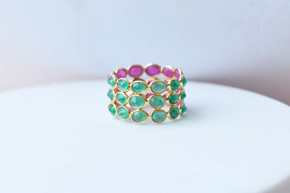 Two-tone emerald and ruby eternity ring in 18K gold