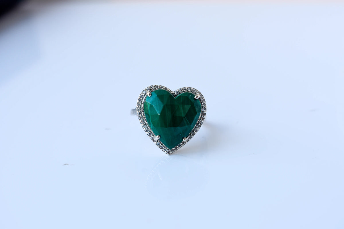 Heart-cut malachite ring in 925 silver with cubic zirconia halo
