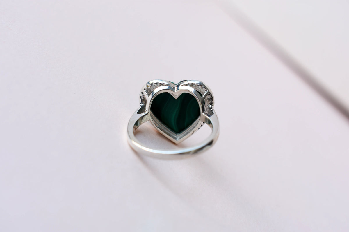Heart-cut malachite ring in 925 silver with cubic zirconia halo