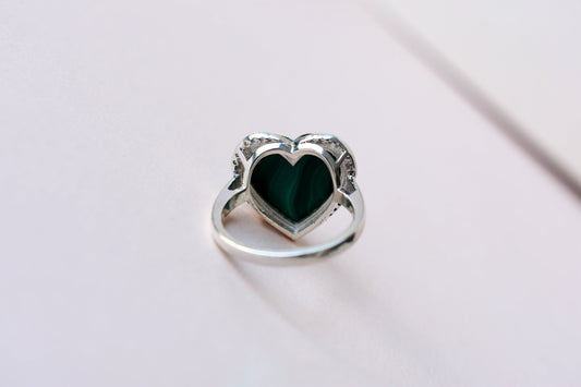 Heart-cut malachite ring in 925 silver with cubic zirconia halo