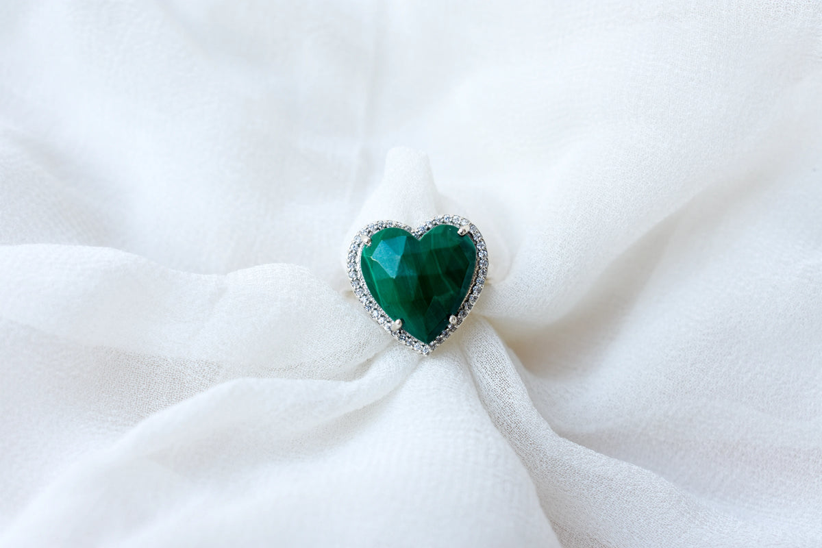 Heart-cut malachite ring in 925 silver with cubic zirconia halo