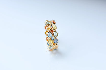 Pear-cut multicolor sapphire woven eternity ring in 18K gold, blue tones