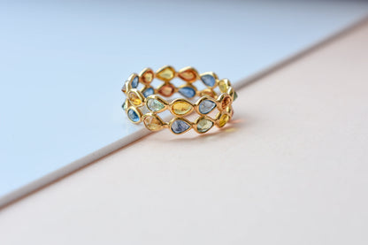 Pear-cut multicolor sapphire woven eternity ring in 18K gold, blue tones