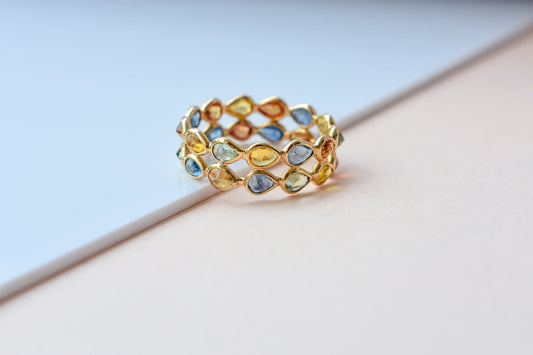 Pear-cut multicolor sapphire woven eternity ring in 18K gold, blue tones