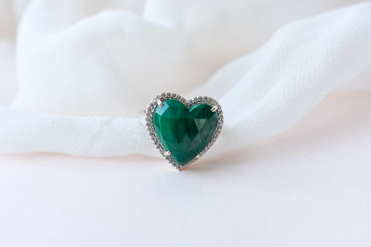 Heart-cut malachite ring in 925 silver with cubic zirconia halo