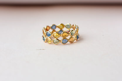 Pear-cut multicolor sapphire woven eternity ring in 18K gold, blue tones