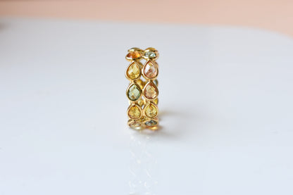 Pear-cut multicolor sapphire woven eternity ring in 18K gold, gold and citrine tones