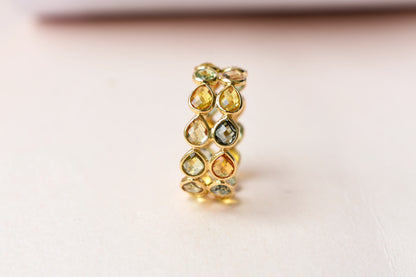 Pear-cut multicolor sapphire woven eternity ring in 18K gold, gold and citrine tones