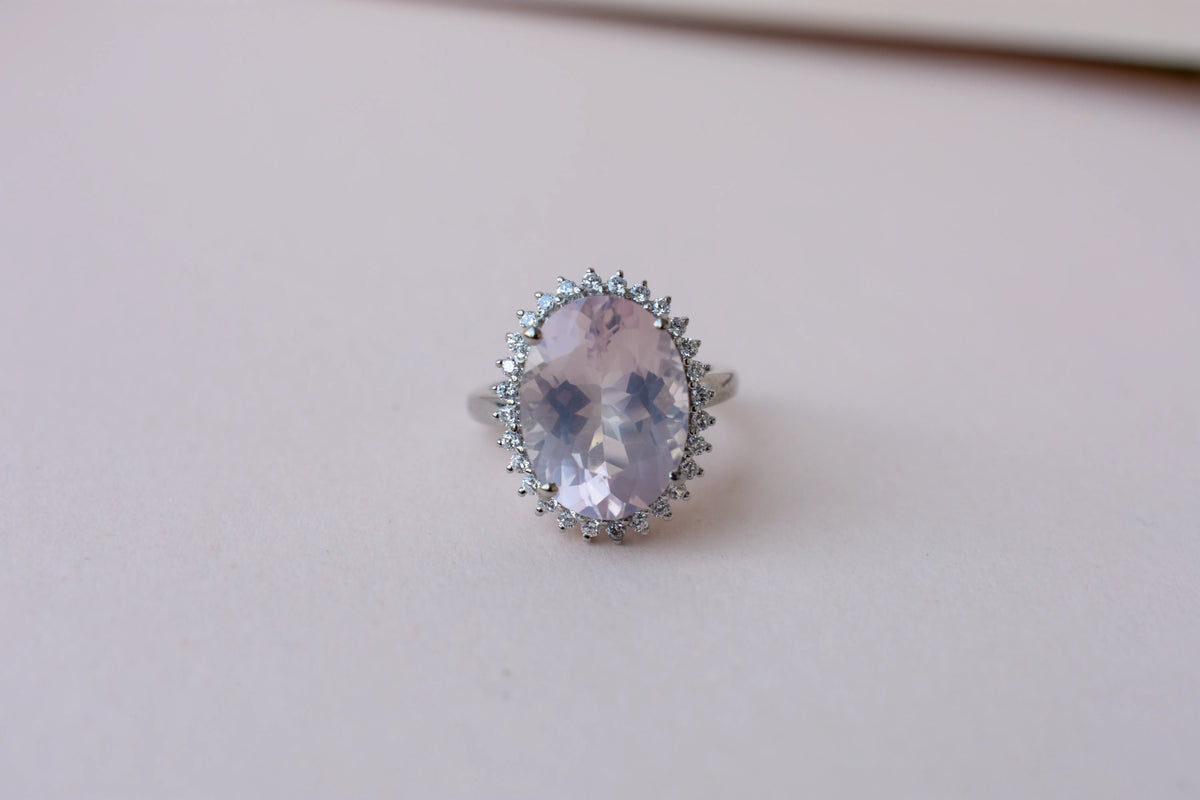 Oval rose quartz halo ring in 925 silver with cubic zirconia accents