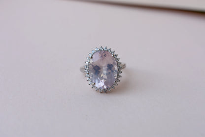 Oval rose quartz halo ring in 925 silver with cubic zirconia accents