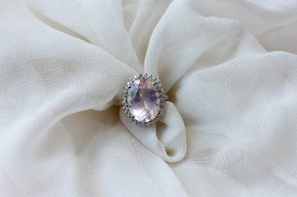 Oval rose quartz halo ring in 925 silver with cubic zirconia accents