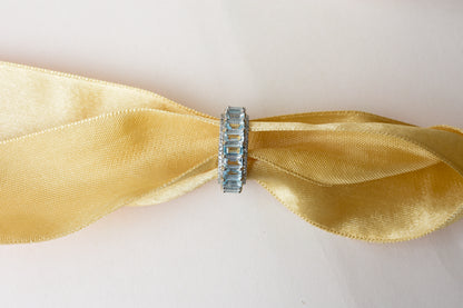 Sky blue topaz emerald-cut eternity ring in 925 silver