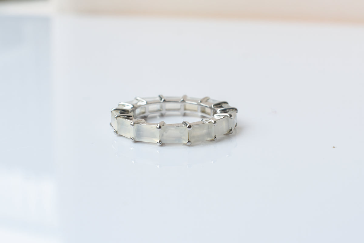 Opalescent white baguette eternity ring in 925 silver