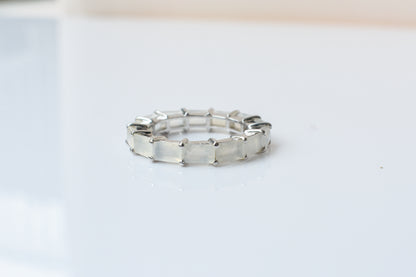 Opalescent white baguette eternity ring in 925 silver