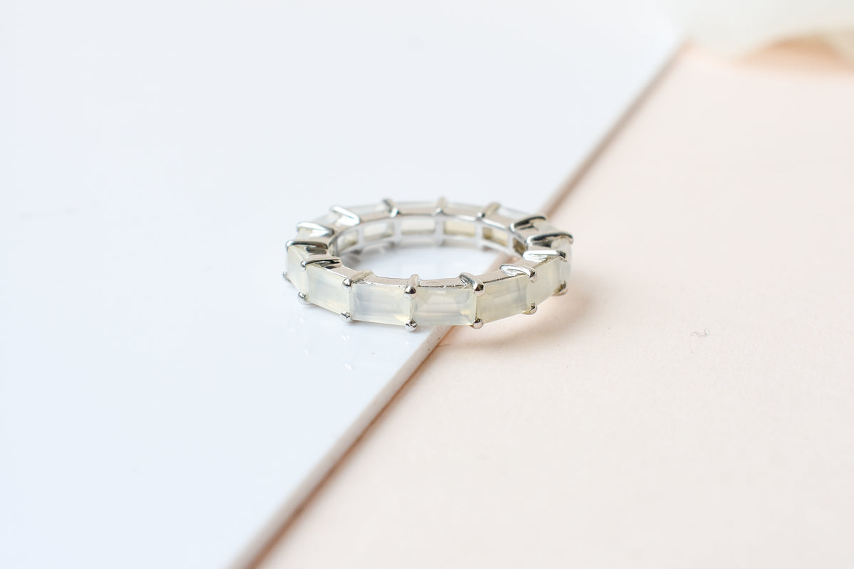 Opalescent white baguette eternity ring in 925 silver