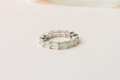 Opalescent white baguette eternity ring in 925 silver