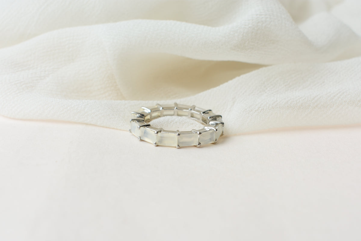 Opalescent white baguette eternity ring in 925 silver