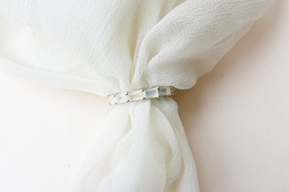 Opalescent white baguette eternity ring in 925 silver