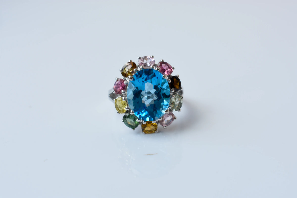 Swiss blue topaz ring with multicolor tourmaline halo in 925 silver