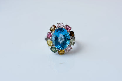 Swiss blue topaz ring with multicolor tourmaline halo in 925 silver