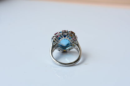 Swiss blue topaz ring with multicolor tourmaline halo in 925 silver