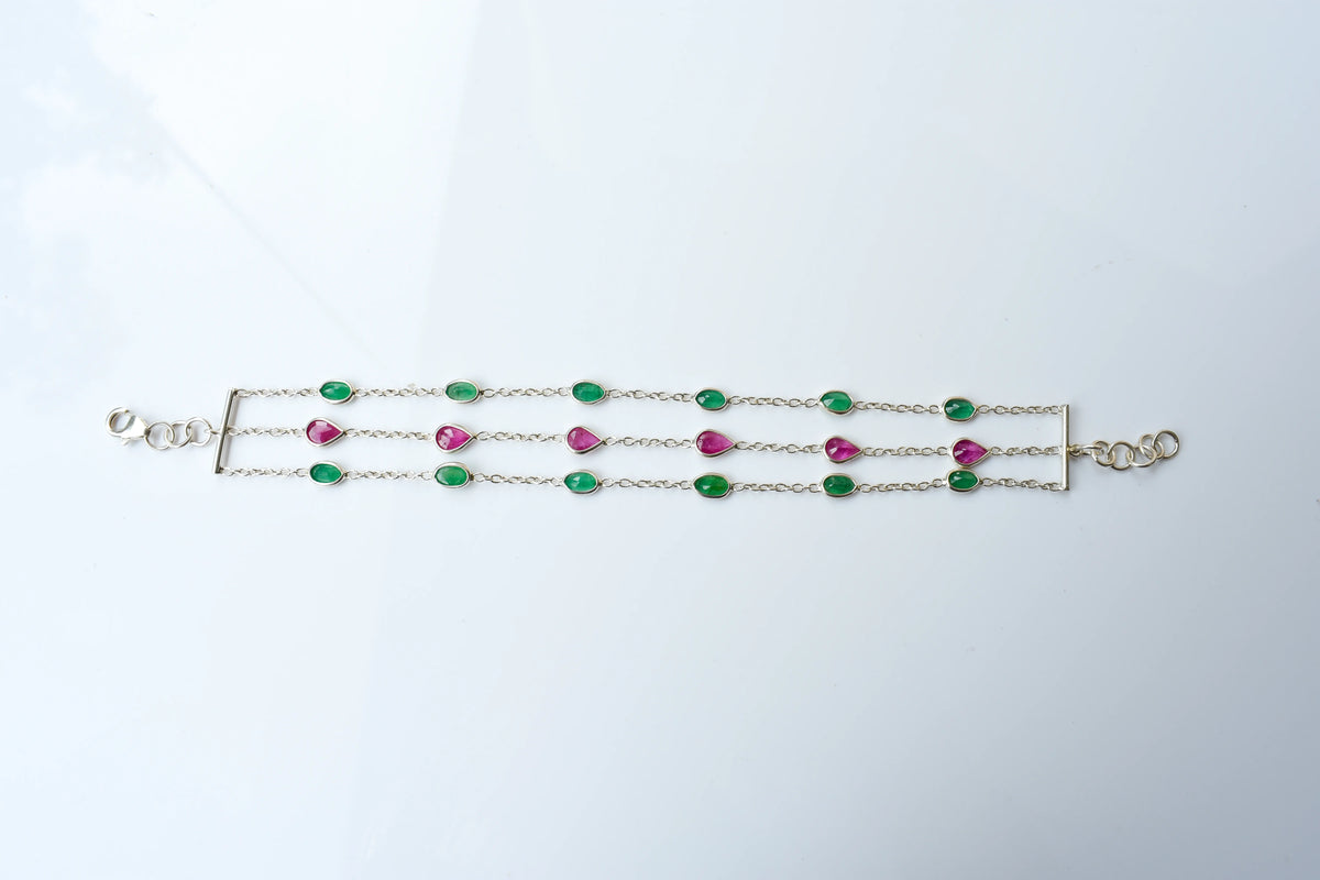 Multi gemstone three-strand bracelet in silver with pink and green stones