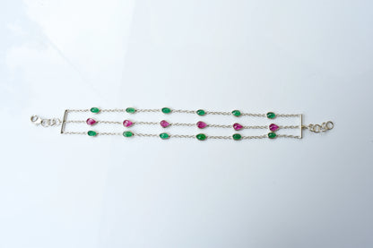 Multi gemstone three-strand bracelet in silver with pink and green stones