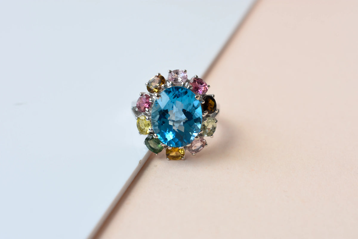 Swiss blue topaz ring with multicolor tourmaline halo in 925 silver