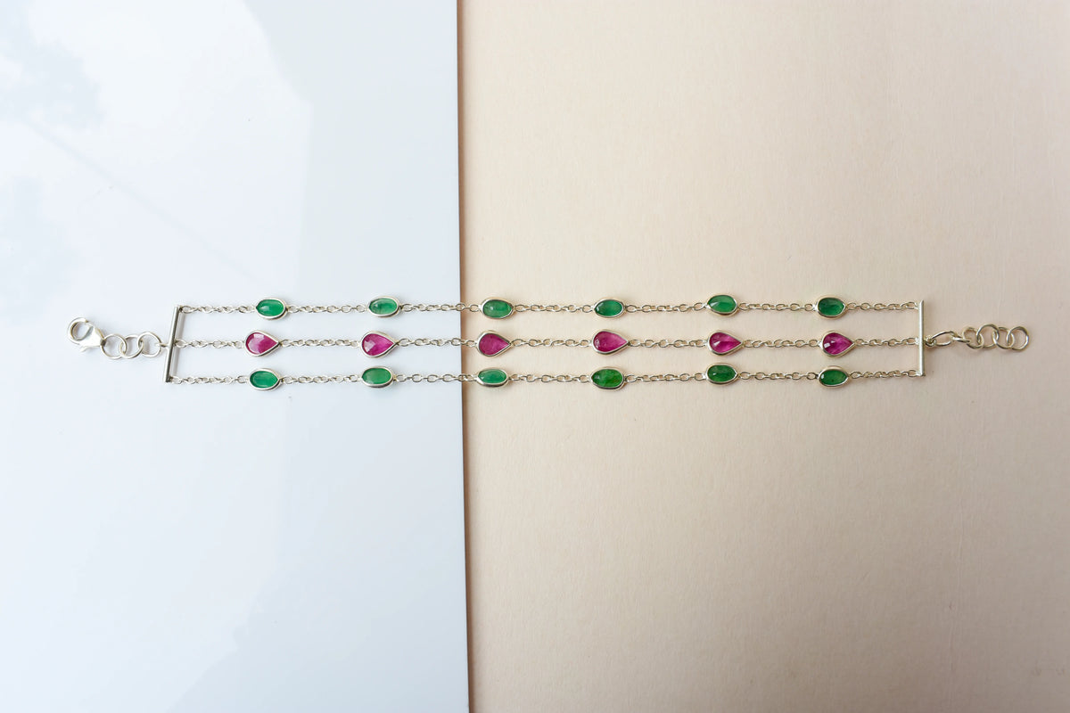 Multi gemstone three-strand bracelet in silver with pink and green stones