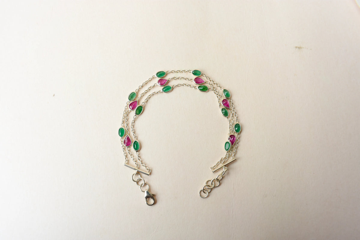 Multi gemstone three-strand bracelet in silver with pink and green stones