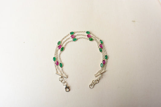 Multi gemstone three-strand bracelet in silver with pink and green stones